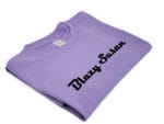 purple t shirt- folded, angle