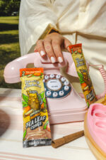 Mango Tea wraps on a table near a pink phone